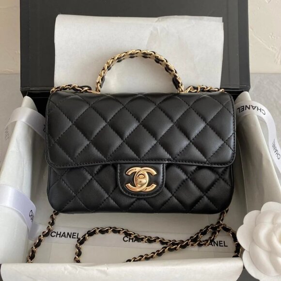 A brand new Chanel classic rectangular flap bag made of black lambskin with a g